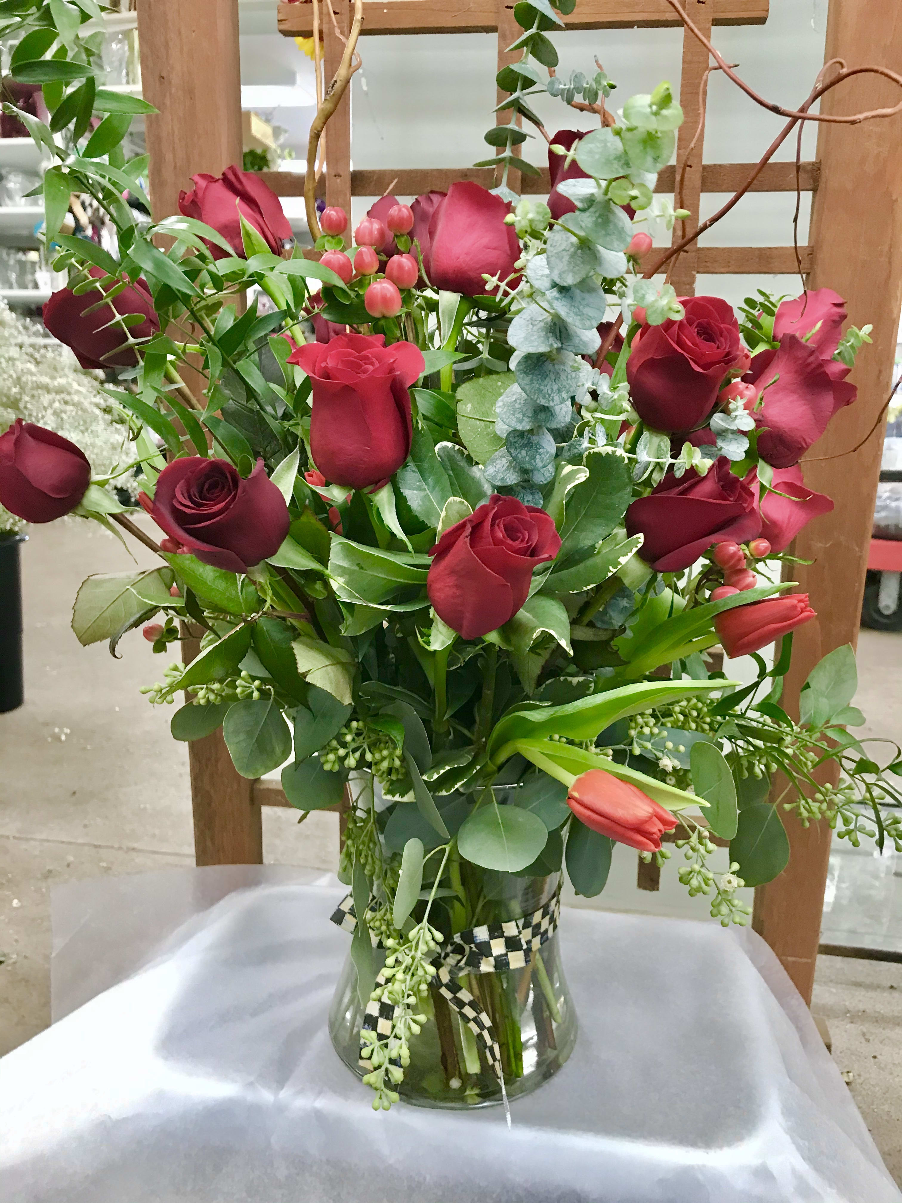 Grand vase of 18 Red Roses. - A beautifully designed arrangement on a grand scale, 18 Red Roses, filler and a variety of greens from our greenhouses.