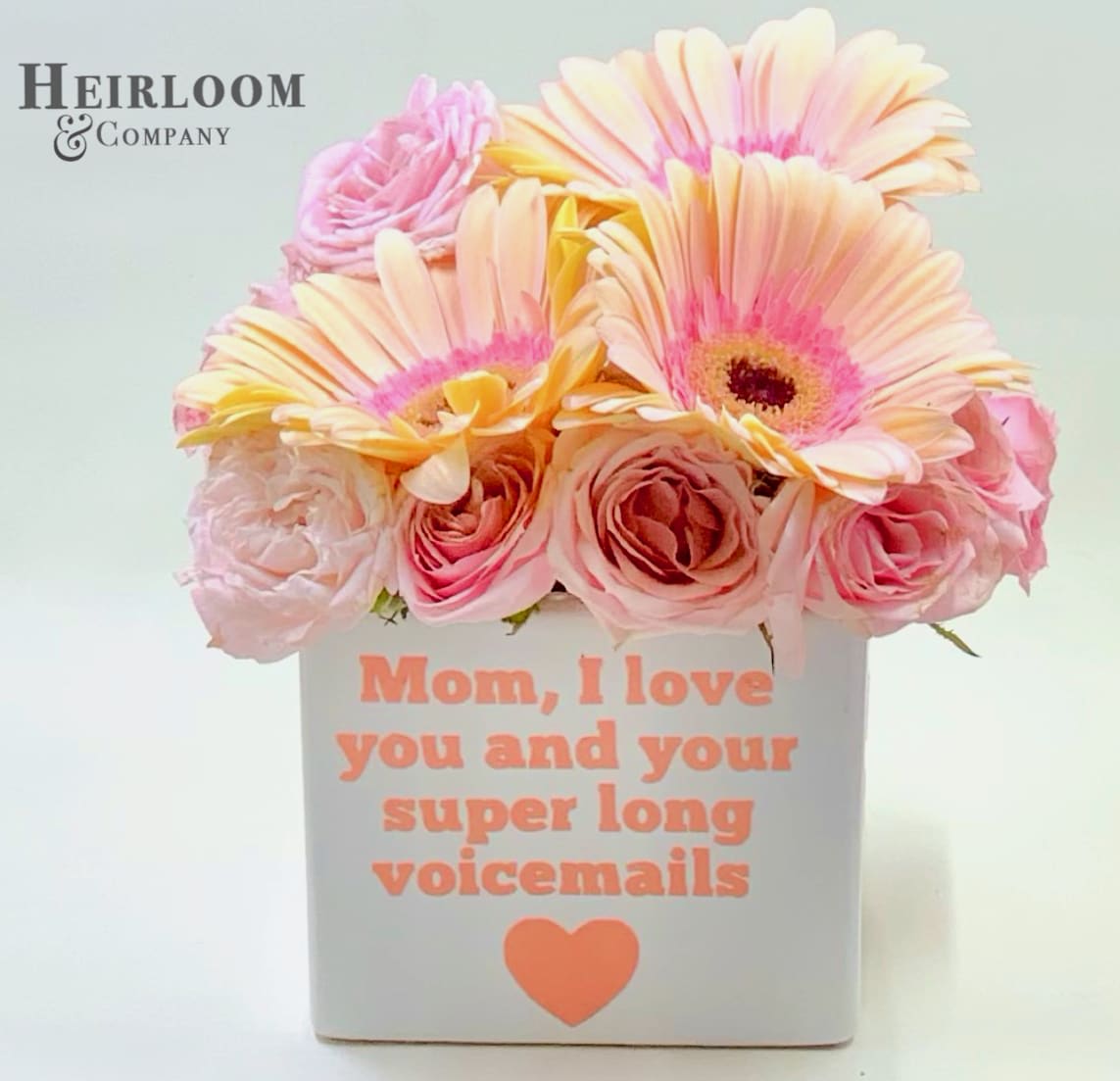 Dear Mom, Text Me - A white cube, an adorably witty message, full of pink and blush daisies and premium mini garden roses. Please note, the container can also be delivered as a plain white container, or a plain container with a fluffiy blush satin  bow 