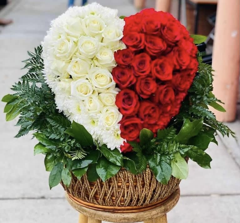 Two Souls Rose Arrangement  - This is a beautiful heart with white and red roses in a basket. Also some white cushions and red carnations on the sides. 