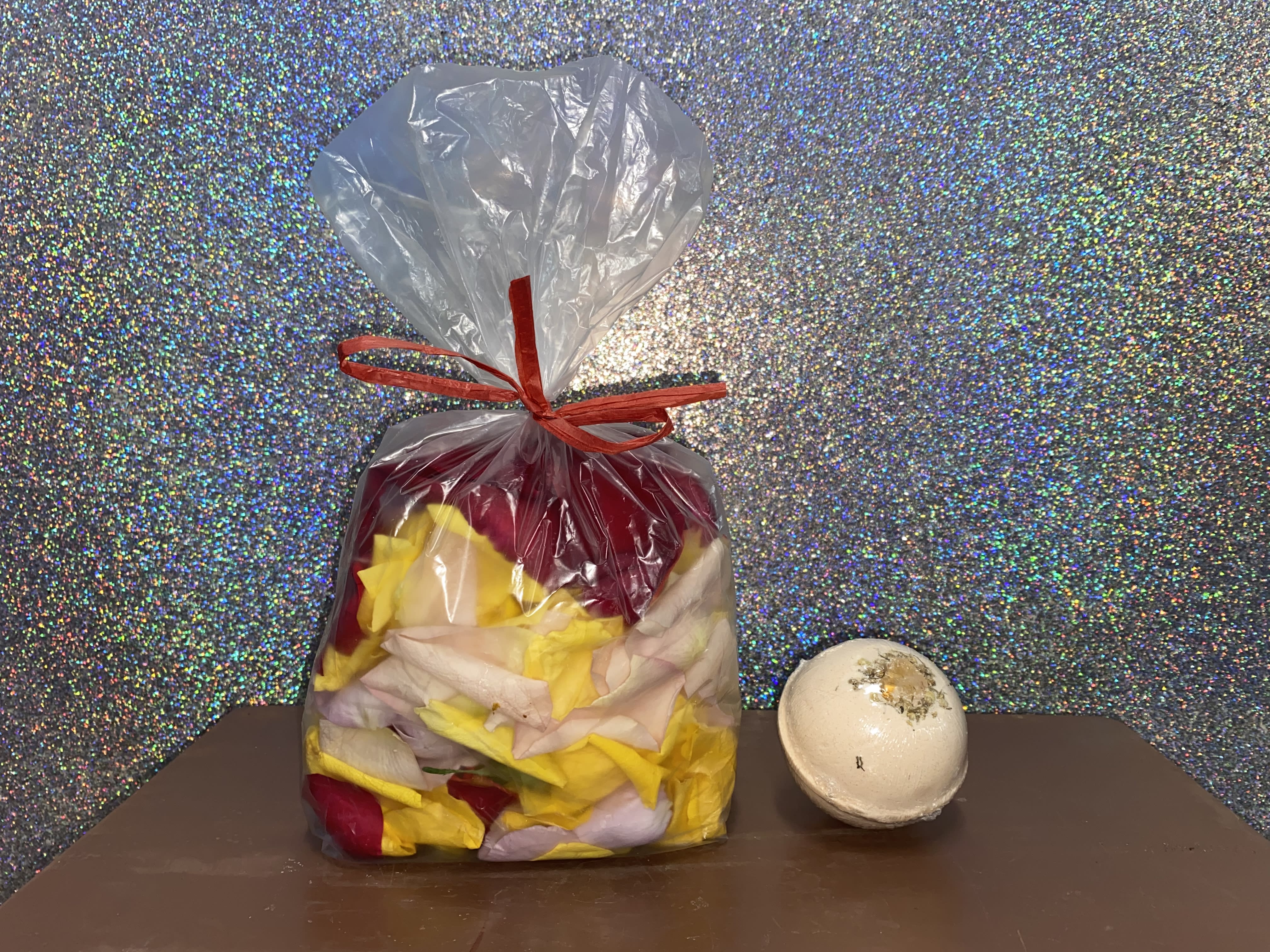 Rose Petal &amp; Bath Bomb Set  - A bag of fragrant, mixed color rose petals and a luscious bath bomb.  Add on a bottle of Deep Love Rose Lemonade or a floral elixir and you have yourself the perfect evening! 