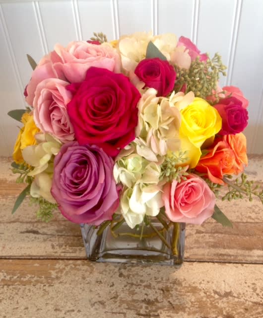 Rosebud Romance - A romantic melange of spray roses in a 5&quot; glass cube or cylinder with curly willow. 
