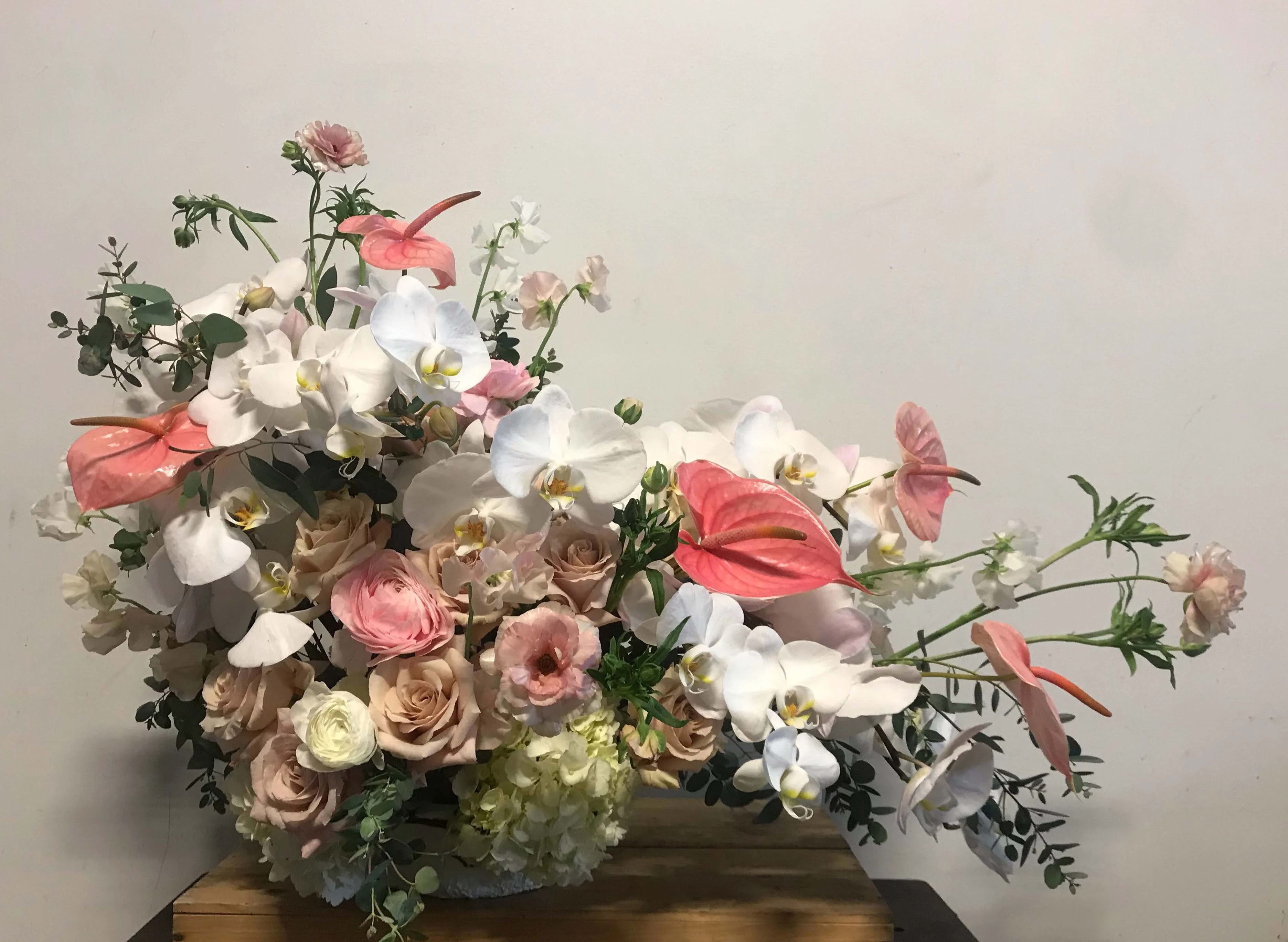 Pink Passion Pink Passion - Super lush boat filled with Phaeleonopsis orchids, Butterfly ranunulus, Quicksand roses, Japanese sweetpea, anthurium and hyrdrangea
