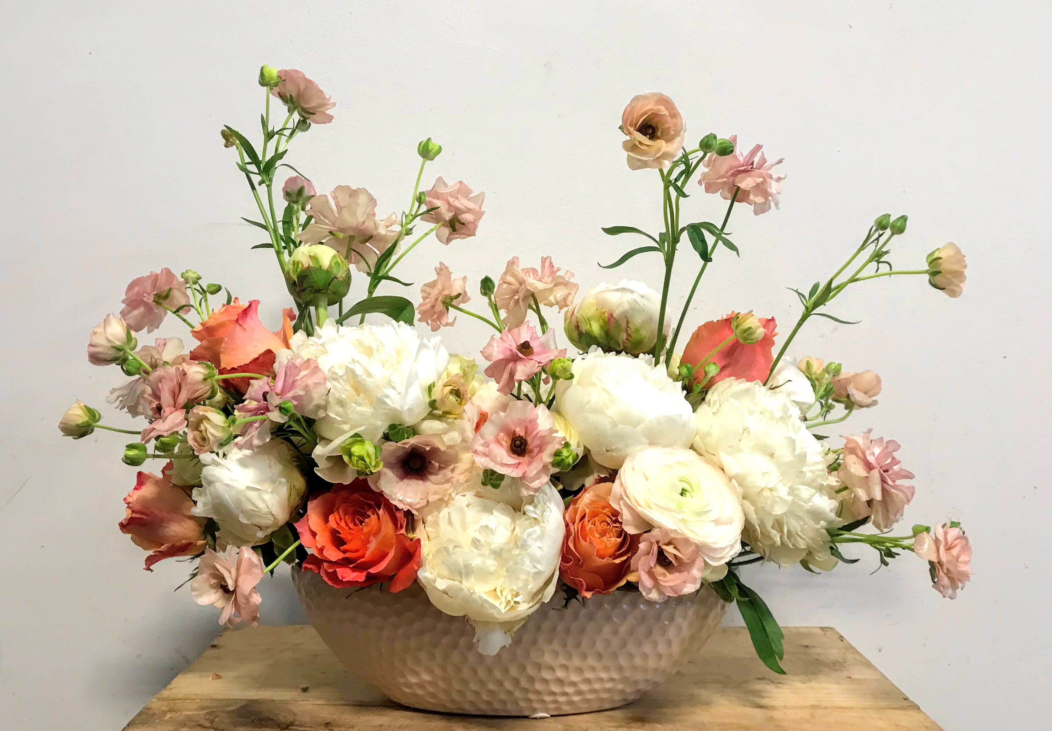 Elegant bowl of cream Elegant bowl of cream - Fluffy romantic boat of luscious, seasonal blooms in pastels.