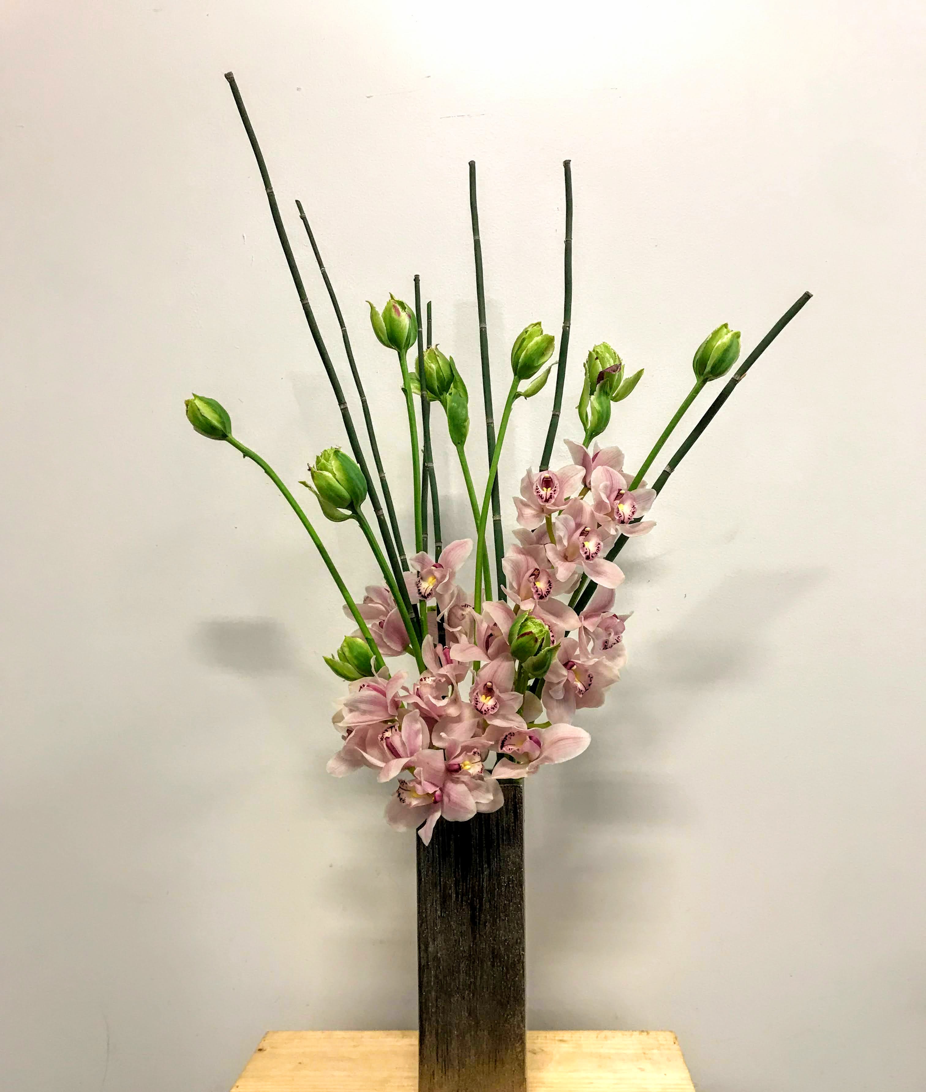 Modern and Minimal Elegance Modern and Minimal Elegance - Elegant upright of French tulips and Orchids