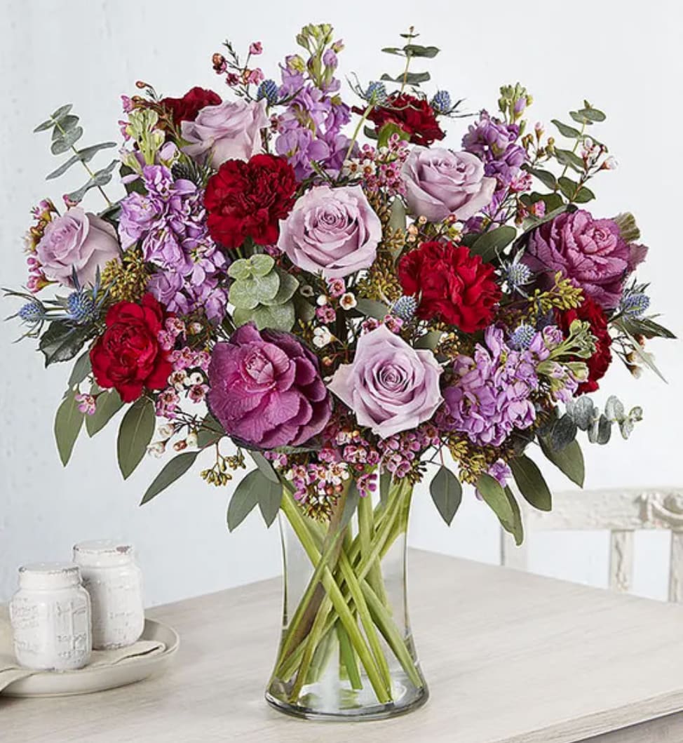 Magical Moonlight™ Bouquet - They’ll be over the moon excited by our eye-catching new bouquet. A rich, bold mix of lavender, burgundy and purple blooms are loosely gathered for a flowy, fresh-from-the-garden style. It’s the kind of gift you send when you want to capture the magic of the moment forever.
