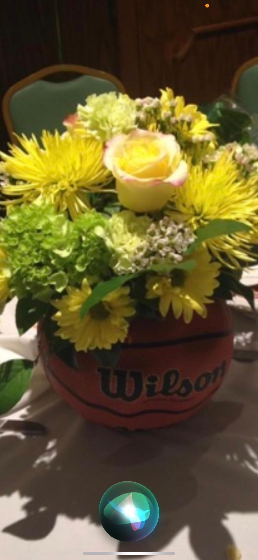 Custom Basketball floral arrangements  - Basketball floral arrangements in real basketball.  School colors