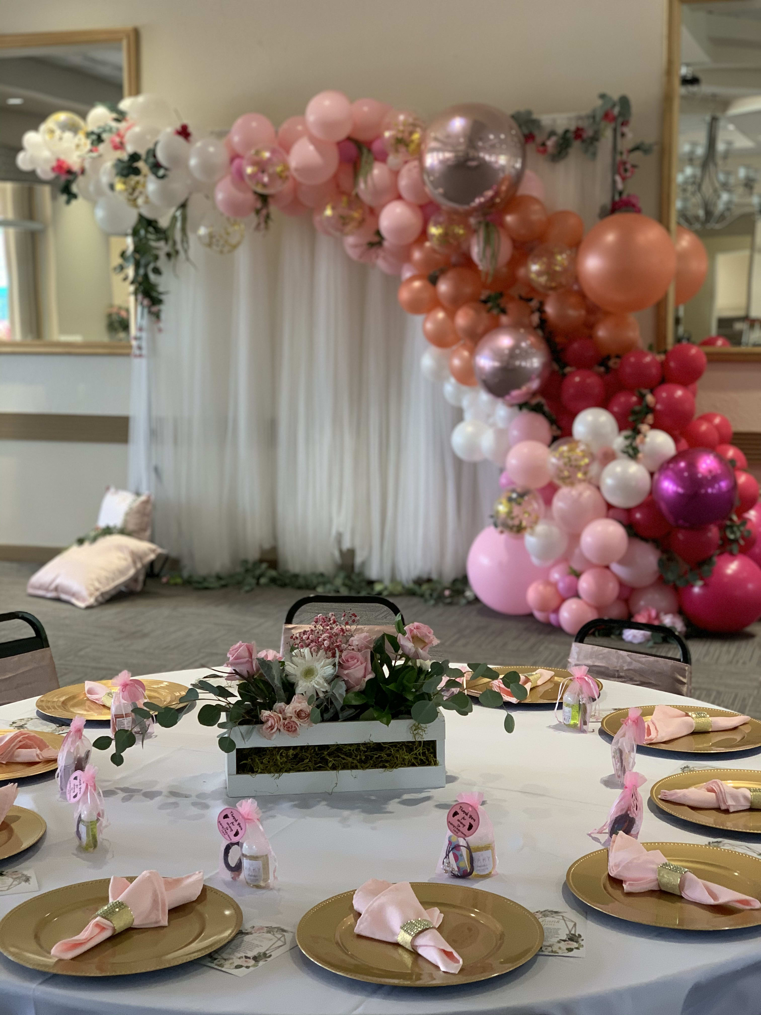 Package deal. A backdrop, balloon garland and 5 table centerpieces.