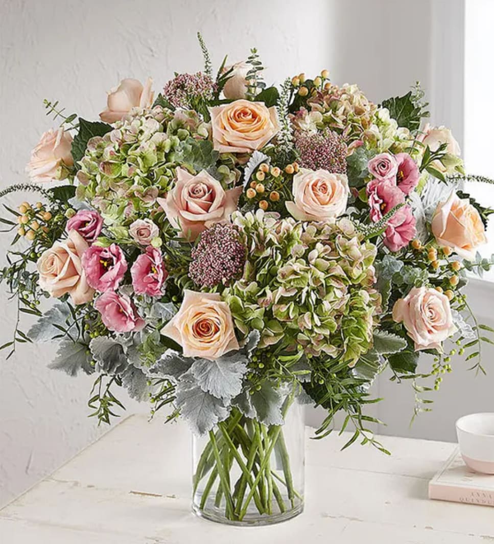 Enchanting™ - They’ll be spellbound from the moment they see our Enchanting bouquet. Part of our new Simply Spectacular Collection showcasing unique varieties and exceptional designs, this luxurious arrangement brings together a loose, flowy gathering of blooms for a fresh-from-the-garden quality. Antique hydrangeas and Veronica add vintage style to soft, blush-colored blooms and natural accents. Available in five sizes, it’s a gift that puts your sentiments beautifully on display.