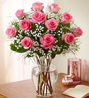 Rose Elegance Premium 1 DOZ Long Stem Pink Roses - Long-stem pink roses are just the gift when you want to express yourself with all the grace, sophistication and elegance they deserve--and more. Give fresh romance and passion with this beautiful, hand-crafted arrangement of premium long-stem pink roses. Our florists select the finest, freshest long-stem pink roses and arrange them by hand with fresh gypsophila in a classic glass vase