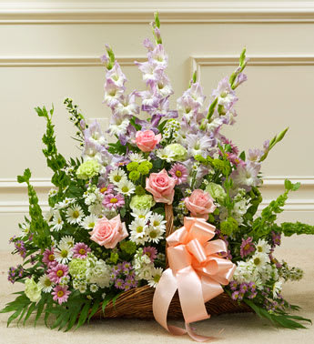 Thoughts and Prayers Fireside Basket - Pastel - Product ID: 91398   This touching tribute beautifully conveys your sympathy and support with elegant hand-arranged pastel blooms. Pastel-hued roses, gladiolas, Bells of Ireland, stock, carnations, button poms, daisy poms and more, hand-arranged by our expert florists Traditionally sent by family, friends or business associates Delivered directly to the funeral home Our florists use only the freshest flowers available so varieties and colors may vary Basket measures 21&quot;L Measures approximately 28âH x 28âL
