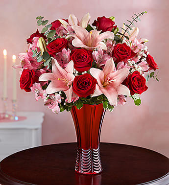 Key to my heart - design in a red vase with lilies roses and other fillers