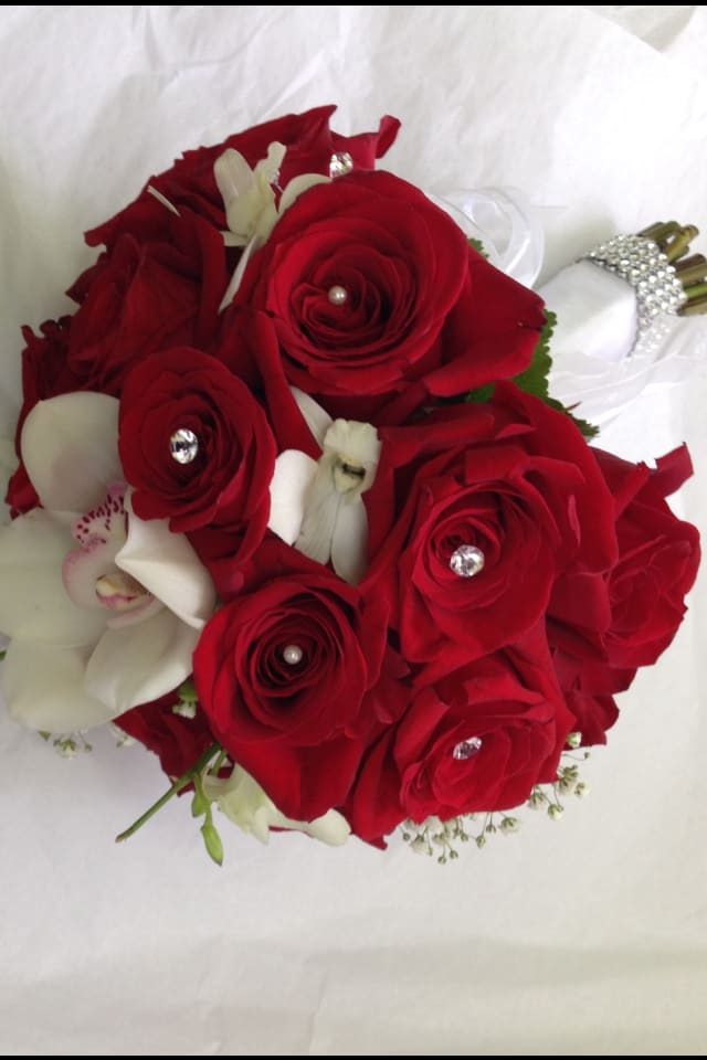 Red Roses bouquet - hand tied red roses with a touch of white cybidiums.