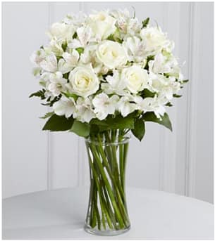 The FTD® Cherished Friend™ Bouquet - The FTD® Cherished Friend™ Bouquet offers comfort and sympathy in the time of grief and loss. Bright white roses and Peruvian lilies are accented by lush greens and gorgeously arranged in a clear glass gathering vase to create a bouquet that will bring peace and show how much you care. GOOD bouquet includes 14 stems. Approximately 18&quot;H x 12&quot;W. BETTER bouquet includes 20 stems. Approximately 19&quot;H x 13&quot;W. BEST bouquet includes 26 stems. Approximately 22&quot;H x 15&quot;W. Your purchase includes a complimentary personalized gift message.