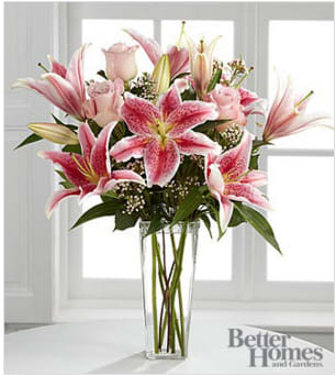 The FTD® Simple Perfection™ Bouquet by Better Homes and Gardens® The FTD® Simple Perfection™ Bouquet by Better Homes and Gardens® - FTD® presents the Better Homes and Gardens® Simple Perfection™ Bouquet. Speak from your heart to theirs with a collection of pink vibrant blooms. Pale pink roses collaborate with the magic of Stargazer Lilies, displaying their fragrant fuchsia petals amidst waxflower accents. Beautifully arranged in a clear square tapered glass vase, this bouquet sends your warmest sentiments with glamour and grace. GOOD bouquet is approximately 20"H x 14"W. Lilies may arrive in various stages of development. The lily blooms will continue to open, extending arrangement life - and your recipient's enjoyment. Your purchase includes a complimentary personalized gift message.