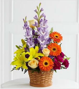 The FTD® Forever Dear™ Arrangement The FTD® Forever Dear™ Arrangement - The FTD® Forever Dear™ Arrangement is a colorful assortment of our finest blooms. Crème de la Crème roses, yellow Asiatic lilies, orange gerbera daisies, lavender gladiolus, plum carnations and purple statice are accented with leatherleaf and sword fern stems. Gorgeously displayed in a natural buff woodchip basket, this arrangement will add to the natural beauty and serenity of thier final tribute. GOOD basket includes 15 stems. Approximately 27"H x 19"W. BETTER basket includes 19 stems. Approximately 32"H x 22"W. BEST basket includes 28 stems. Approximately 32"H x 23"W. Your purchase includes a complimentary personalized gift message.