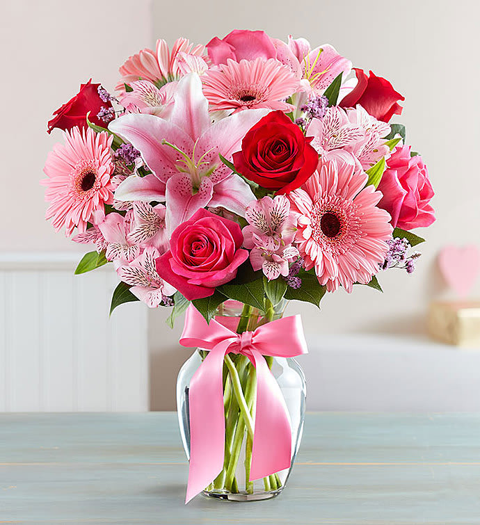 FIELDS OF EUROPE ROMANCE - Inspired by the rich beauty of the European countryside, our romantic bouquet reveals all the feelings you have in your heart. Fresh-picked pink &amp; red blooms are on display inside a glass vase finished with ribbon, creating a timeless gift for someone you love.