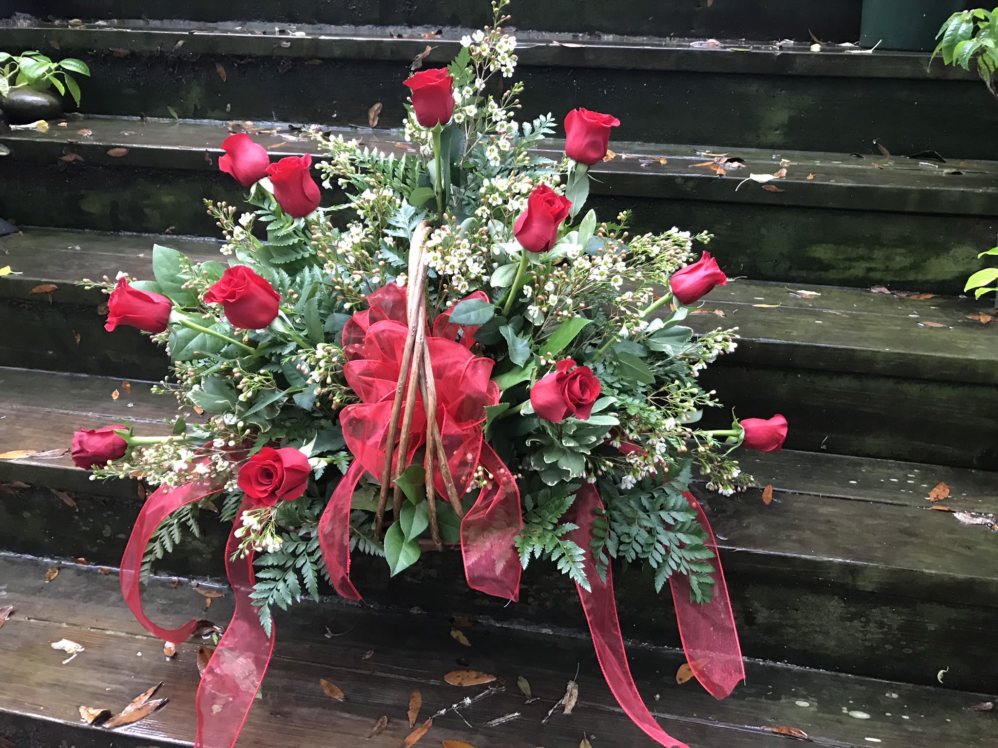 Farewell, Love Farewell, Love - A simple fireside basket made grande with beautiful roses. Can be made with any color rose (must specify for other than red).