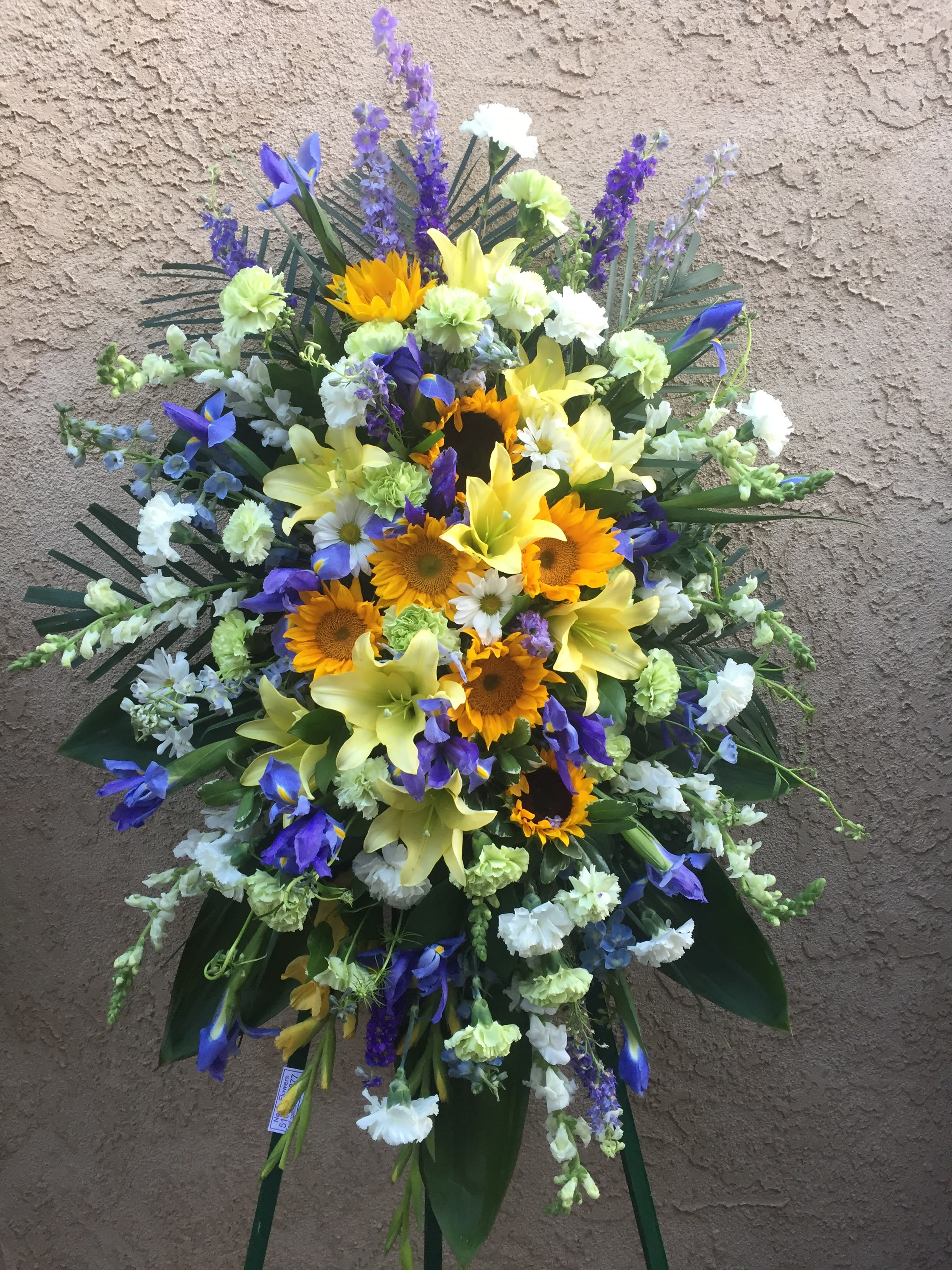 Funeral Spray 7 - Funeral standing spray with white, blue and yellow. DELUXE SIZE AS SHOWN.