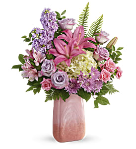  Pleasing Pastels Bouquet - Pleasing as can be! This Mother's Day, delight her with this gorgeous, cherry quartz-inspired art glass vase, bursting with pastel roses, hydrangea and lilies.White hydrangea, lavender roses, pink spray roses, pink asiatic lilies, pink alstroemeria, lavender stock and lavender cushion spray chrysanthemums are arranged with sword fern, leatherleaf fern, and huckleberry. Delivered in a Pink 'n Peach Paradise vase. Approximately 18 1/4&quot; W x 22 1/2&quot; H