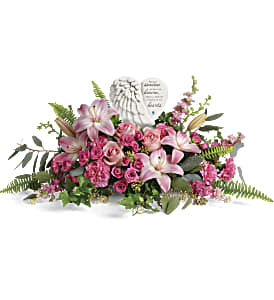 Heartfelt Farewell Bouquet - A heartfelt celebration of a truly special life, this magnificent bouquet of pink roses and lilies beautifully surrounds a touching porcelain keepsake they'll treasure forever.This heartfelt bouquet includes pink roses, pink spray roses, pink asiatic lilies, pink carnations, pink larkspur, green ivy, seeded eucalyptus, silver dollar eucalyptus, and sword fern. Delivered with a Heaven's Heart Keepsake. Approximately 29 1/2&quot; W x 14&quot; H