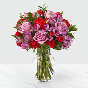 The FTD In Bloom ™ Bouquet - This bouquet is as classic as they come. In it, you'll find a lavender and red color palette made up of roses, alstroemeria and carnations. While this arrangement is a wonderful pick for sharing your love or delighting for a birthday, we think it's perfect for every occasion! 
