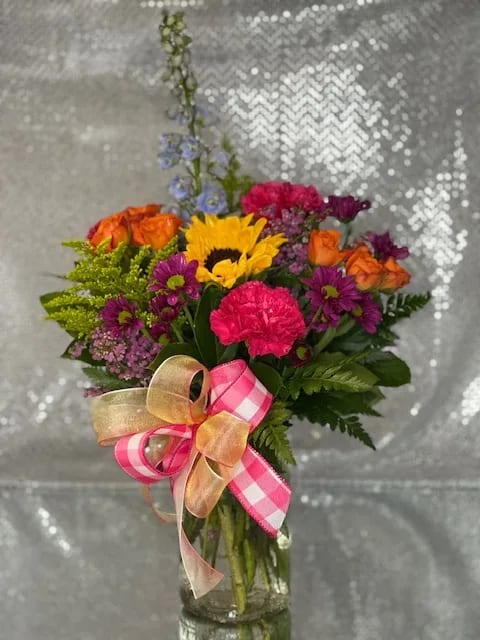 Bright Eyes - beautiful mixed flowers in a clear container