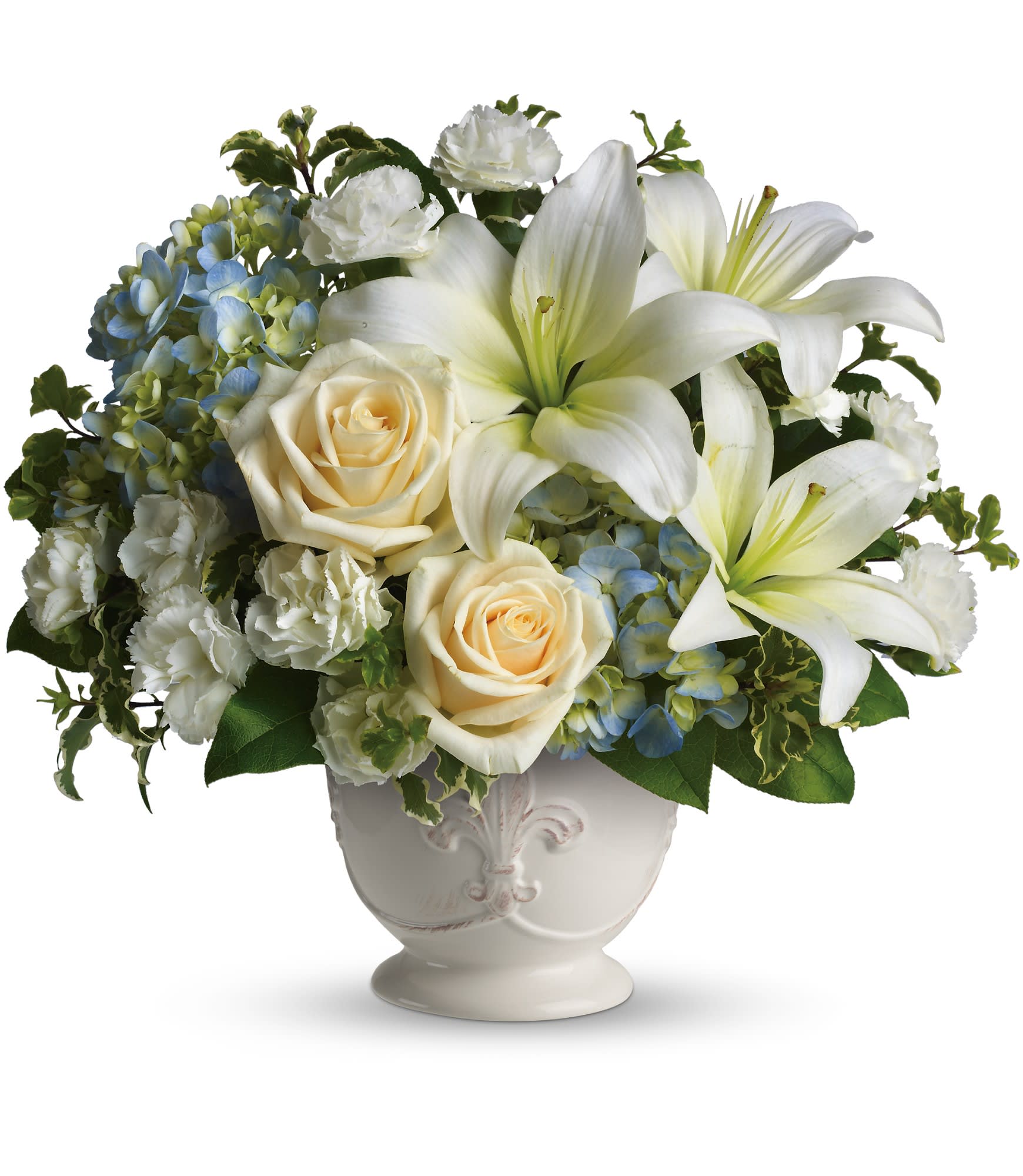 Beautiful Dreams by Teleflora - Soothing and respectful. Calm and compassionate. This beautiful collection of white and light colored blossoms will deliver your loving thoughts perfectly. 