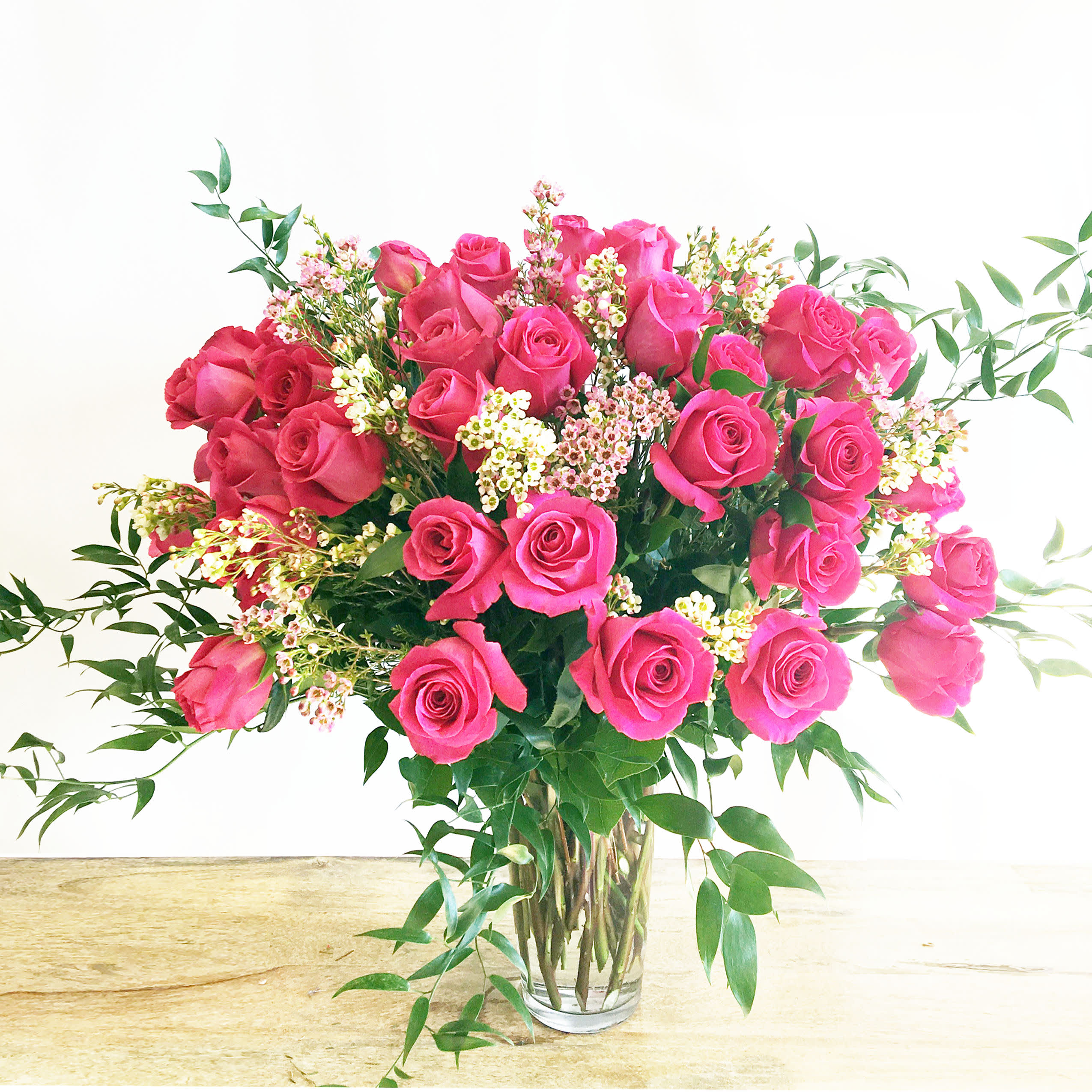 Extravagance Romance Pink or any Color Roses  - The Extravagance Romance Pink rose arrangement is a beautiful cluster of romantic roses designed to inspire love. Express your love to the one you admire most with this romantic floral bouquet. 2 dz Standard, 3 dz Deluxe, 4 dz Premium