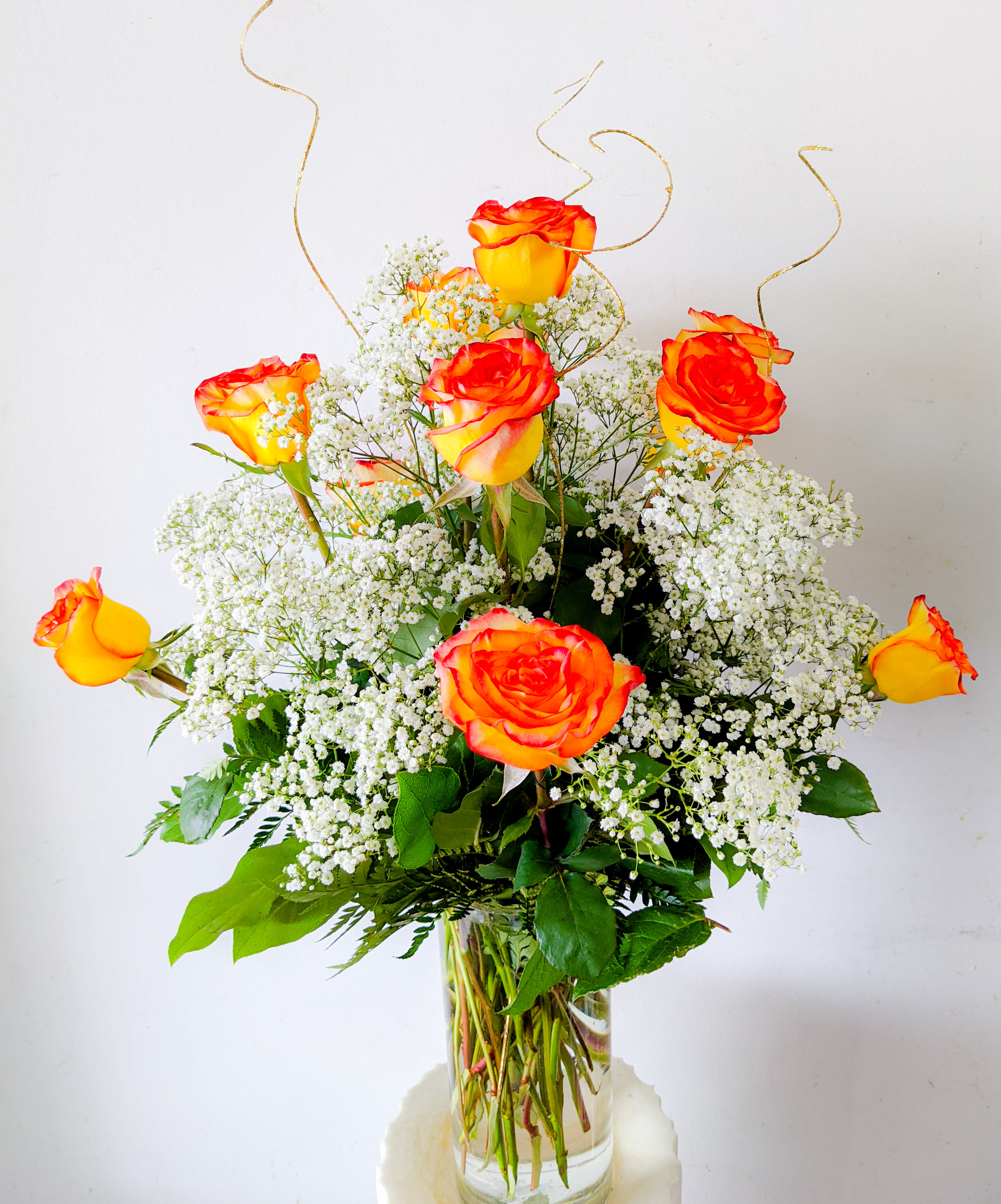 1 dz. Bicolor Roses - 1dz. sunset hue Bicolor Roses elegantly arranged in a 5&quot; x 12&quot; glass cylinder vase.