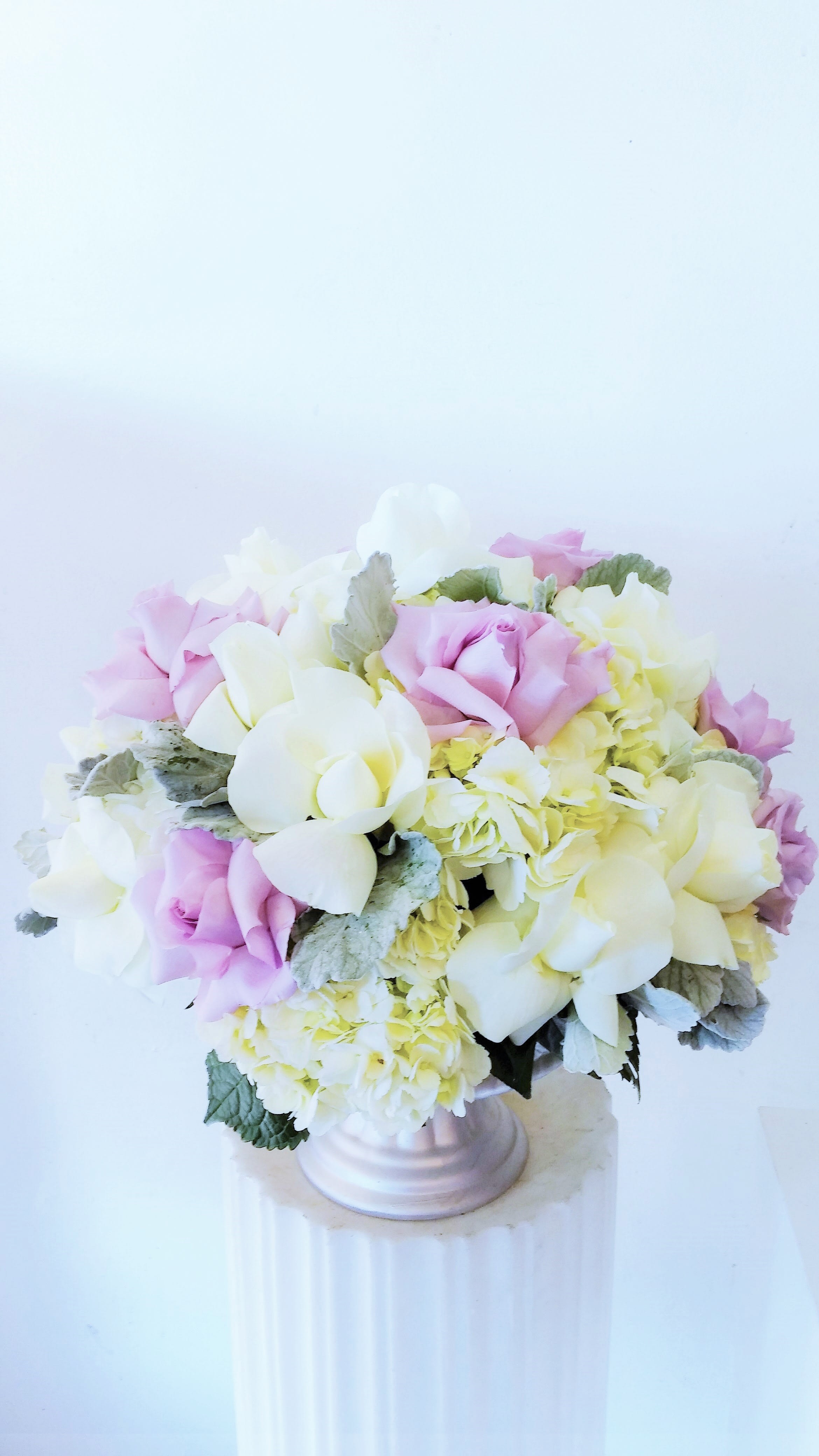 Victorian-Roses and Hydrangea Victorian-Roses and Hydrangea - Silver ceramic cup filled with a mixture of roses, hydrangea, and dusty miller accents.