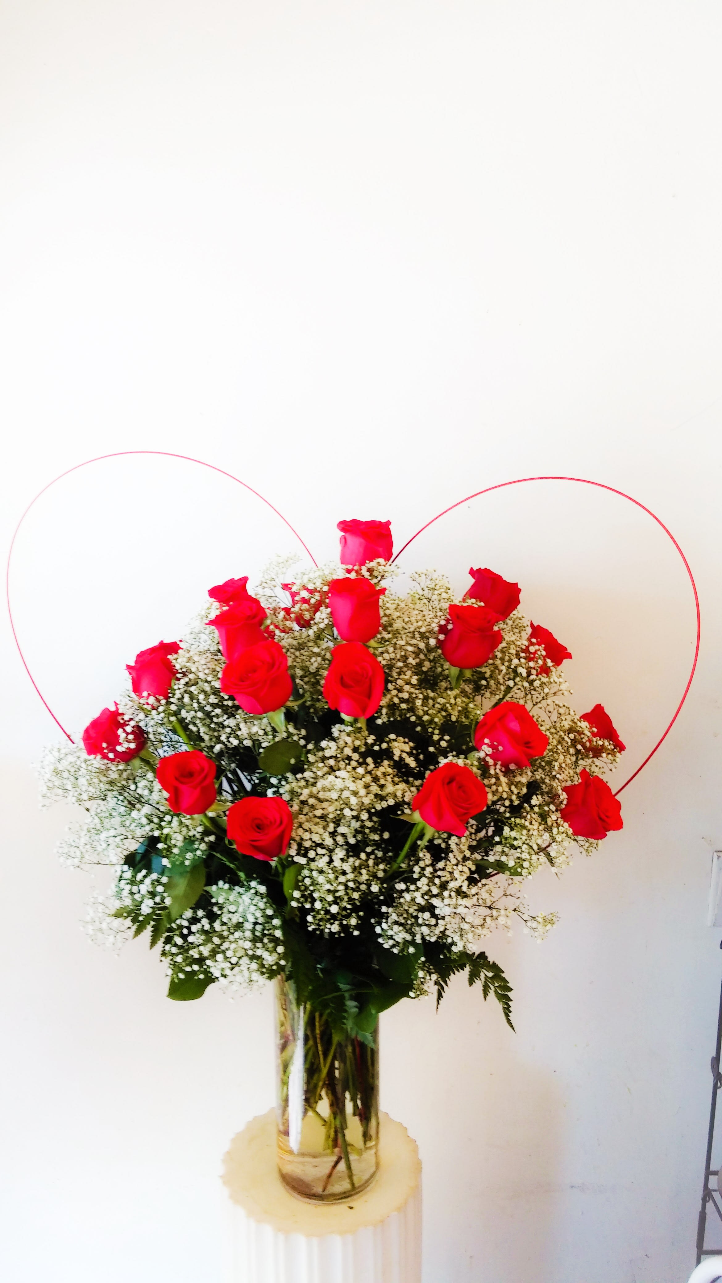 2 Dozen Red Roses with <3 2 Dozen Red Roses with <3 - 2 dozen red roses elegantly arranged in a 5" x 12" cylinder vase, with a unique heart accent.