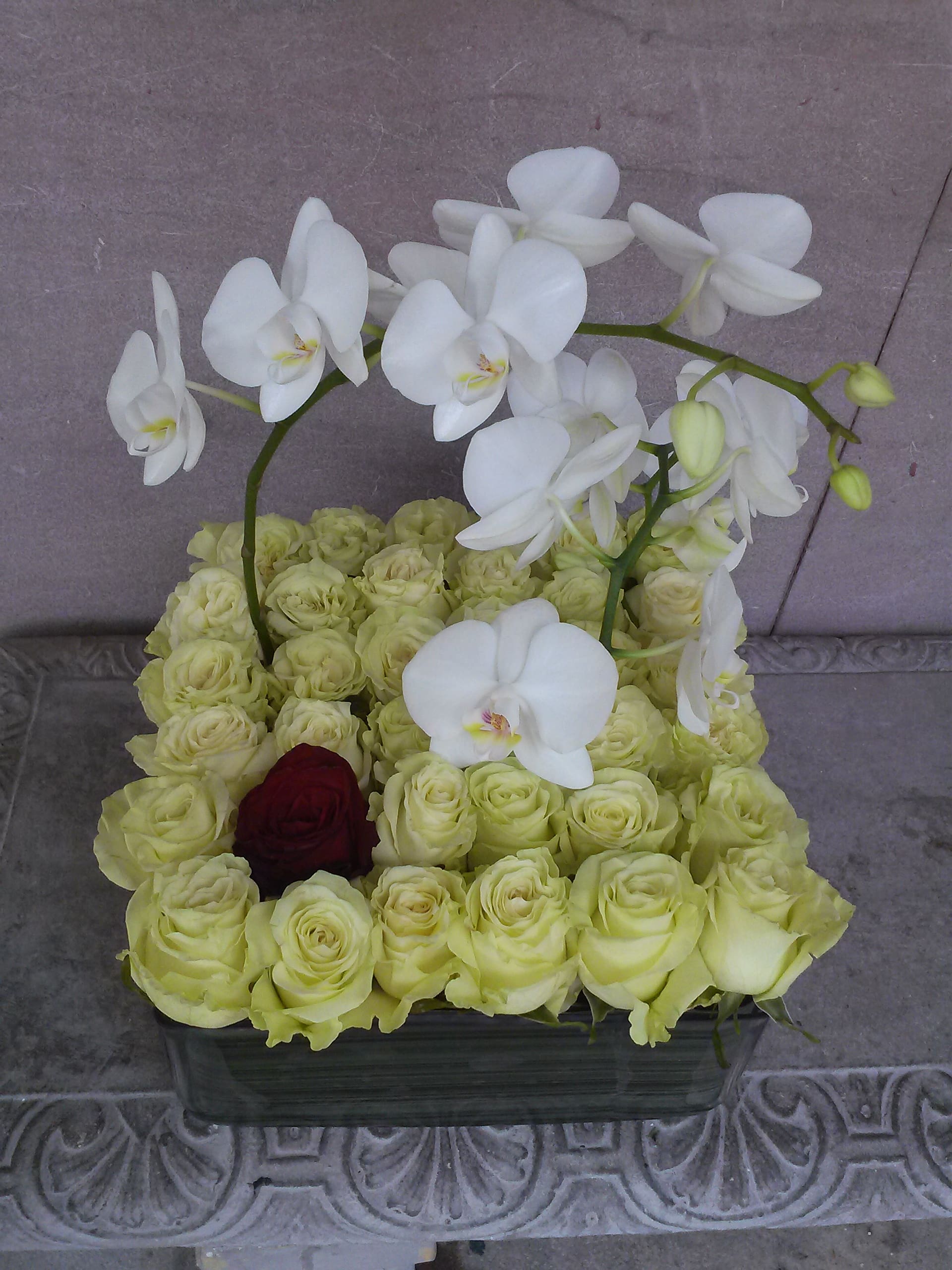 modern love - low glass square roses and orchids
