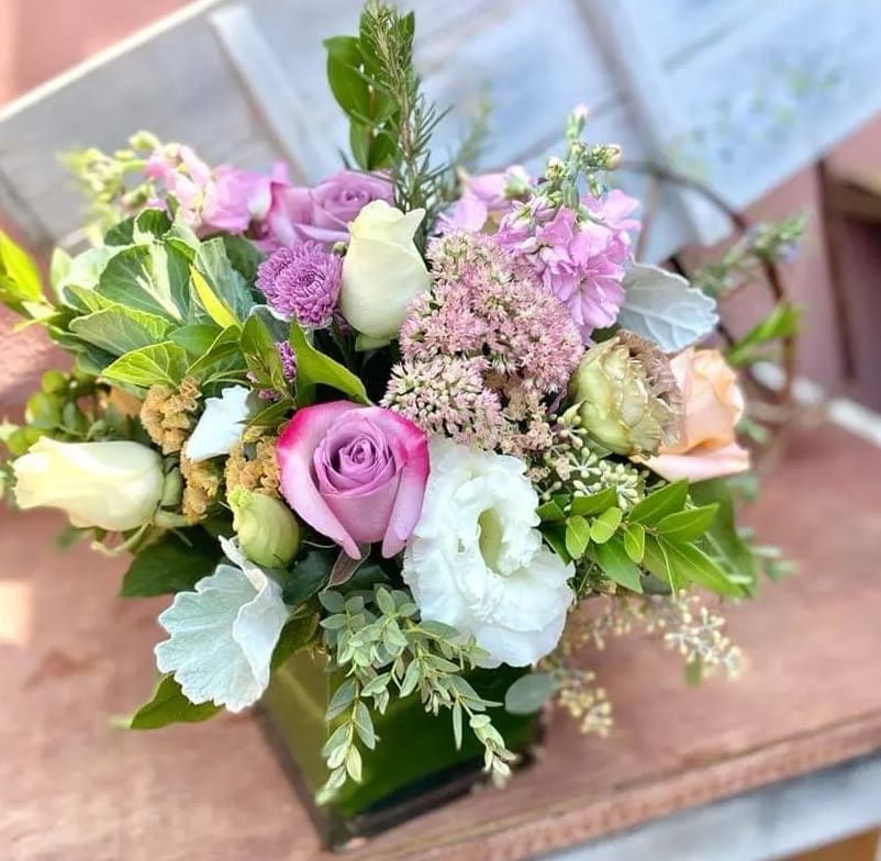 Mamma Mia Mamma Mia - White Lisianthus,roses, stocks, dusty miller, wild greenery, purple stocks, all hand arranged in glass vase.