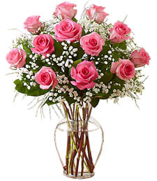 Pink Hearts Valentine's Day Bouquet - A marvellous medley of color and fragrance, these pink roses, nestled among lush greens, make for a tantalizing treat for your special someone this Valentine's Day.