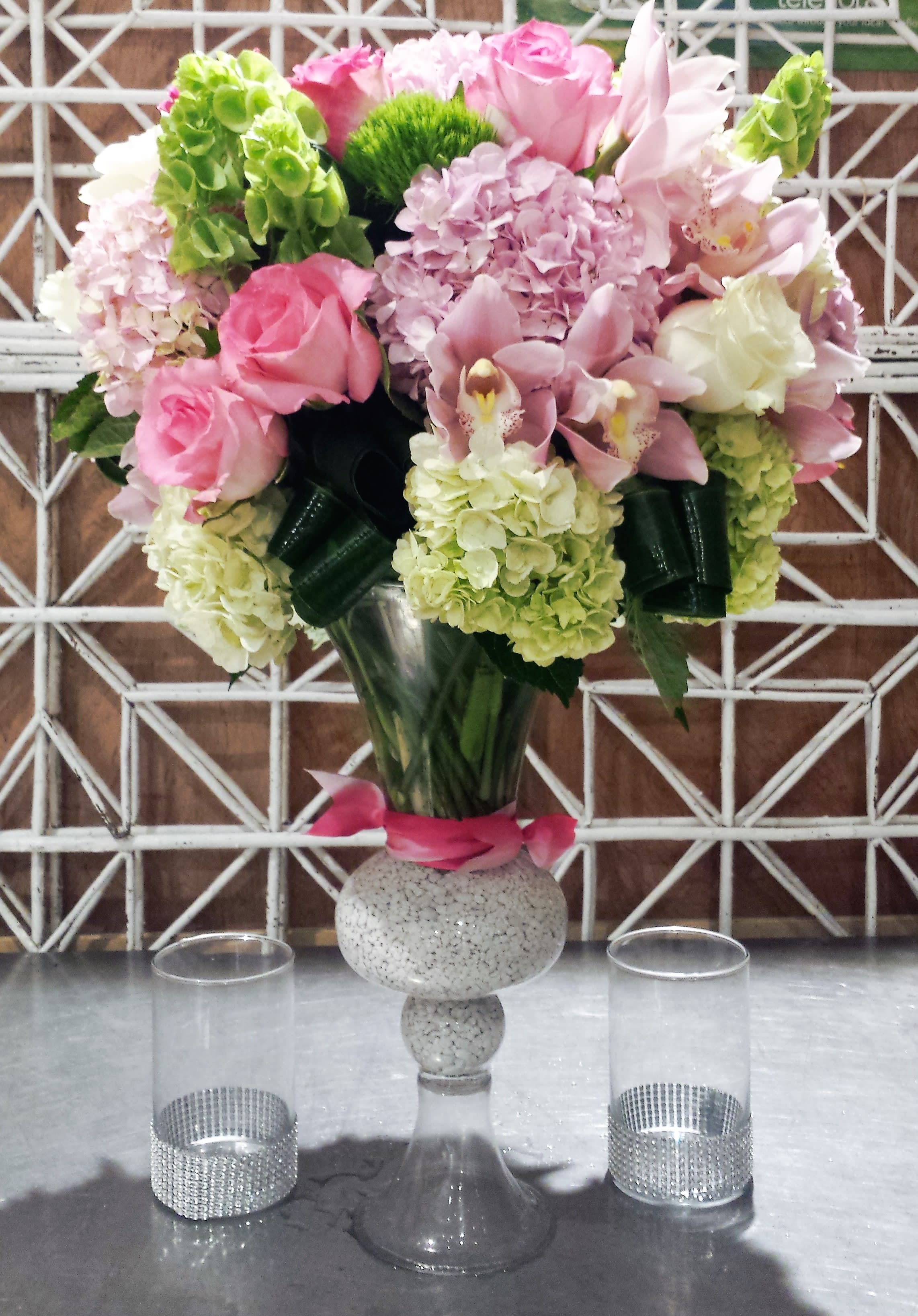 Touching - Soft and lovely with elegance and class.  This modern and impressive vase arrangement comes fashioned in an all around design best suited for a special occasion.  Let the flowers speak for you with this compassionate and touching design.  