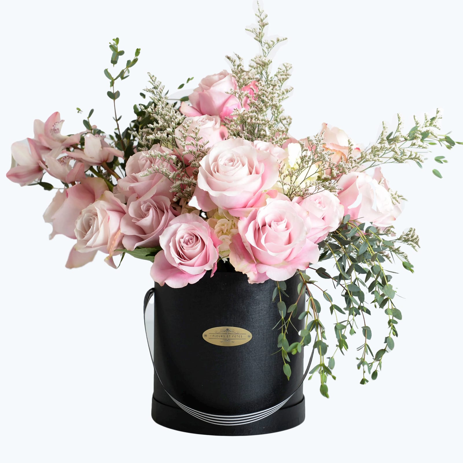 Peacefulness - Featuring fresh flowers. This arrangement with a softer pink hue conveys a sense of sweetness and romance. Designed in our large signature box.  *Due to Covid-19, some flowers may not be available. Fleurs et Fetes reserves the right to adjust the flowers and color depending on availability*