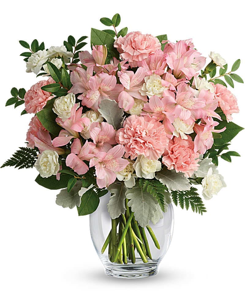 Teleflora's Whisper Soft Bouquet - In the prettiest shade of whisper-soft pink, this breathtaking bouquet proclaims your affection in a most powerful way! This delicate arrangement includes pink alstroemeria, pink carnations, white miniature carnations, dusty miller, huckleberry, leatherleaf fern, and lemon leaf.