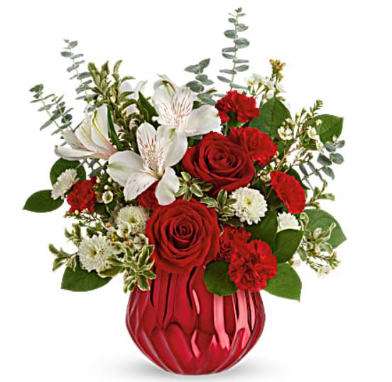 Heart Shine Bouquet Heart Shine Bouquet - Send a truly enchanting gift this Valentine's Day with this delicate red rose bouquet, presented in a swirling ceramic vase with sparkling metallic finish. This lovely arrangement features red roses, white alstroemeria, miniature red carnations, white button spray chrysanthemums, white wasflower, spiral eucalyptus, pitta negra and lemon leaf. Delivered in Teleflora's Enchanted Gem cylinder.