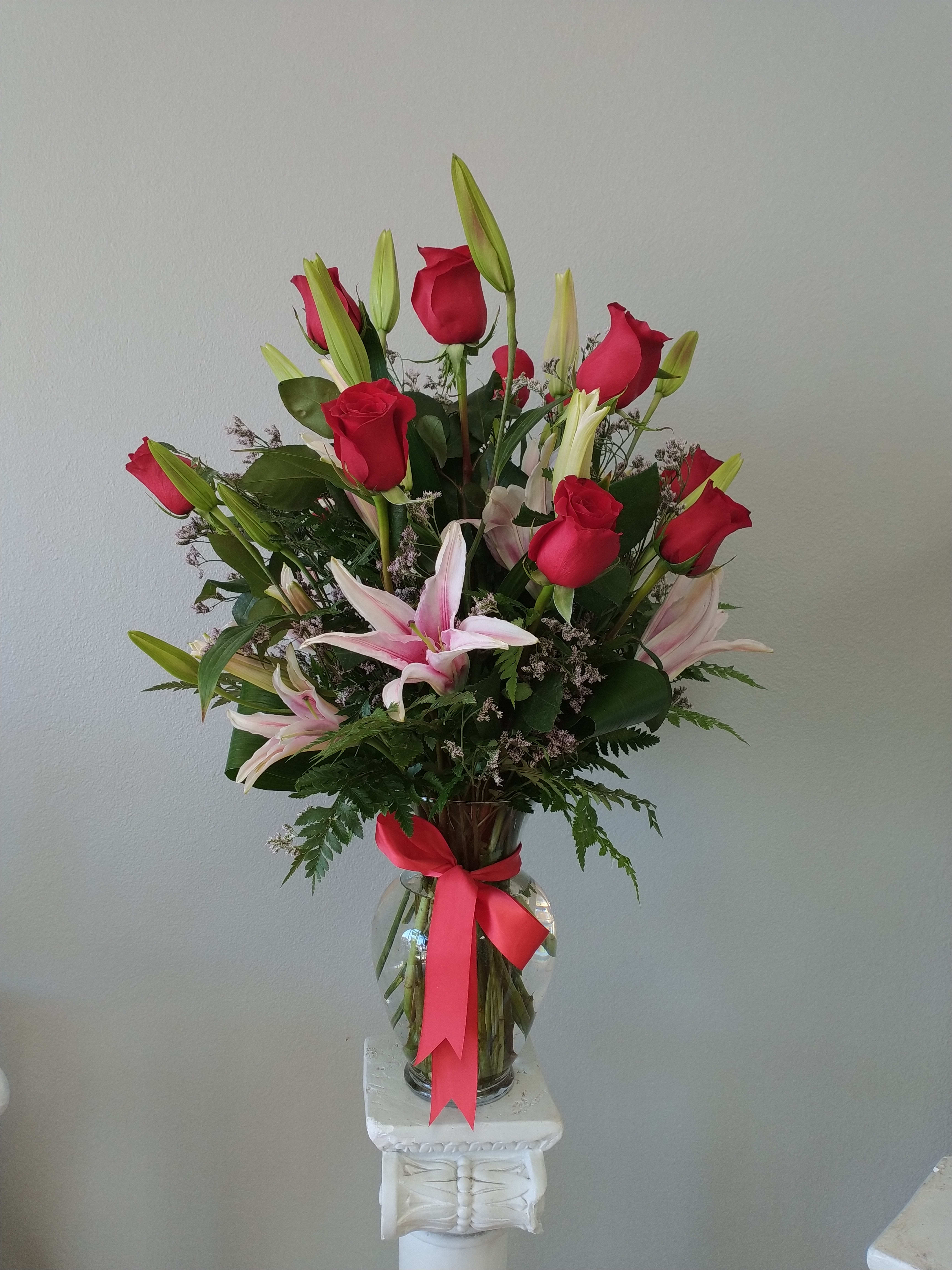 Kayla's treasure Kayla's treasure - A tried-and-true showstopper, Kayla's treasure features a dozen red roses, upgraded with stargazer lilies and seasonal foliage.