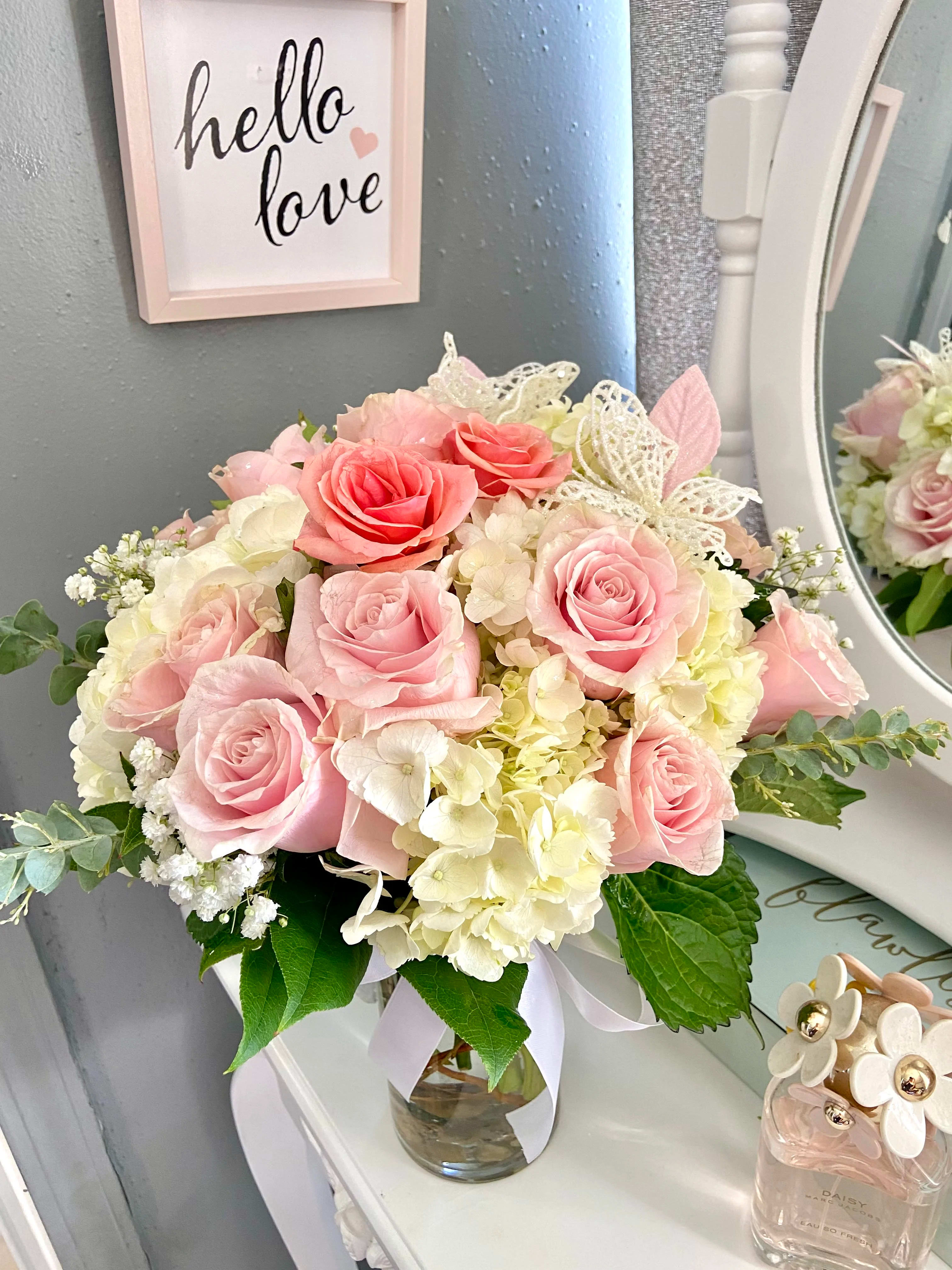 Hello love! - Hey love! This lovely arrangement is composed of White hydrangeas, soft pink roses, fresh eucalyptus  and stunning white butterflies… Absolutely beautiful and elegant! 