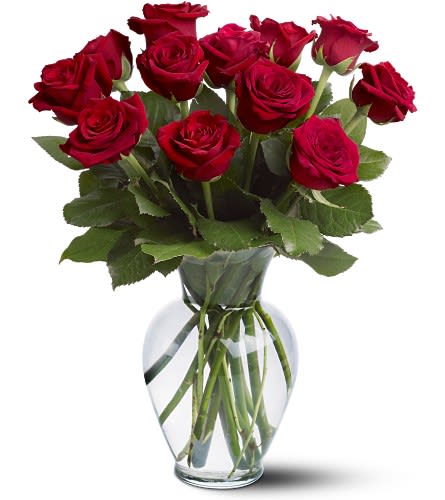 12 Red Roses 12 Red Roses - Celebrate your passion with fiery red roses. A dozen red roses arrive perfectly arranged in a clear glass vase. Orientation: All-Around As Shown : 12RDROSE