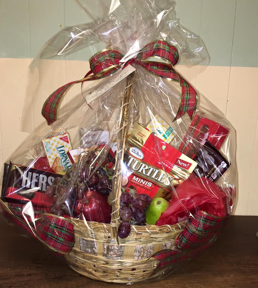  Fruit, Cookie and Candy Basket - A Variety of scrumptious candies, cookies and fruit all come together in a beautiful wicker basket. The perfect yummy gift for anyone on your list!!