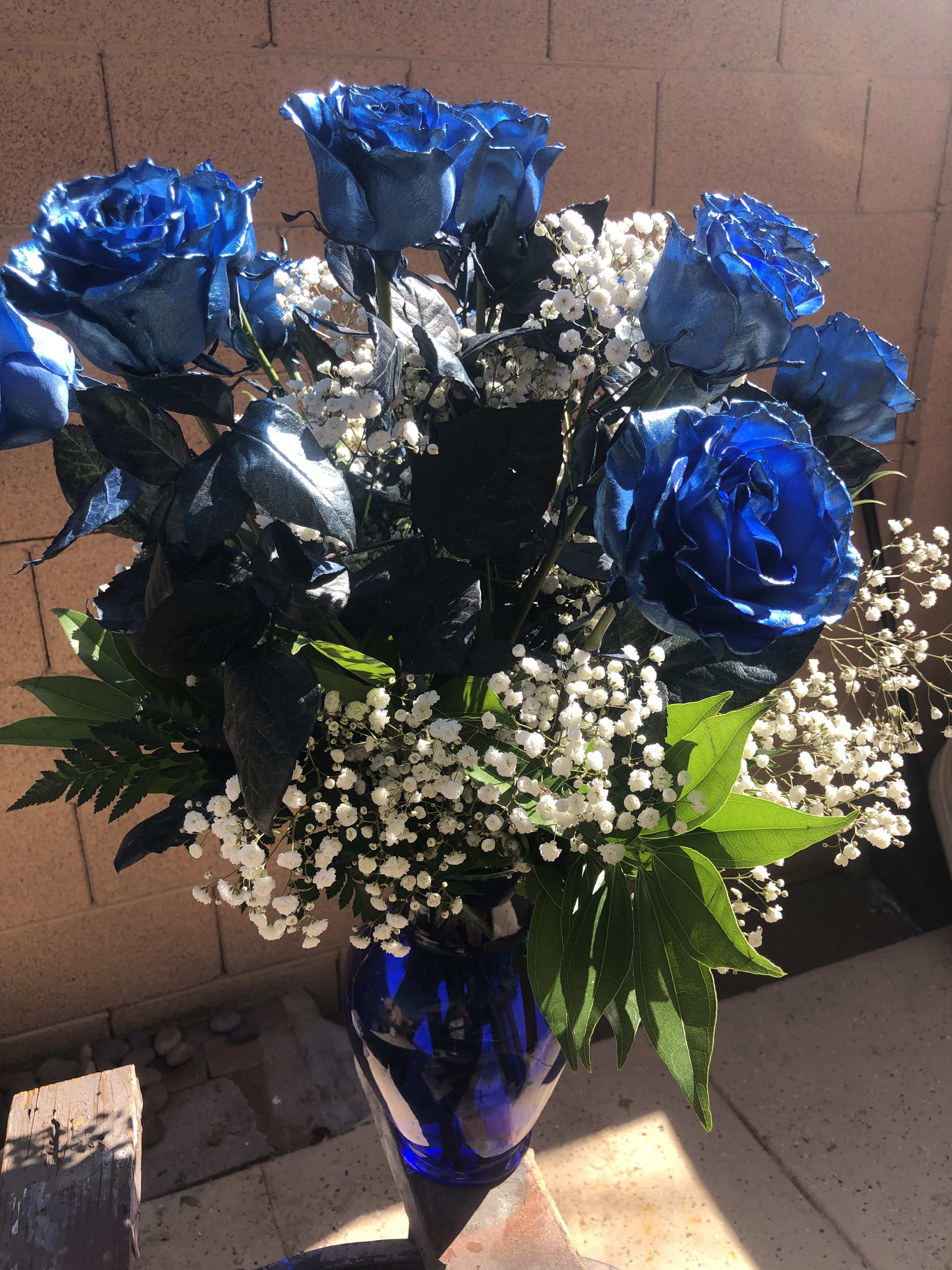 Dozen blue metallic roses by Pam's Floral