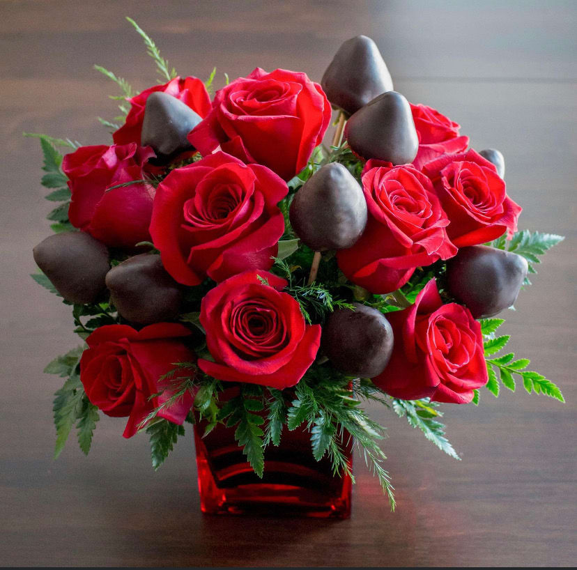Red roses and Chocolate covered strawberries by Lira’s Flowers & Events LLC