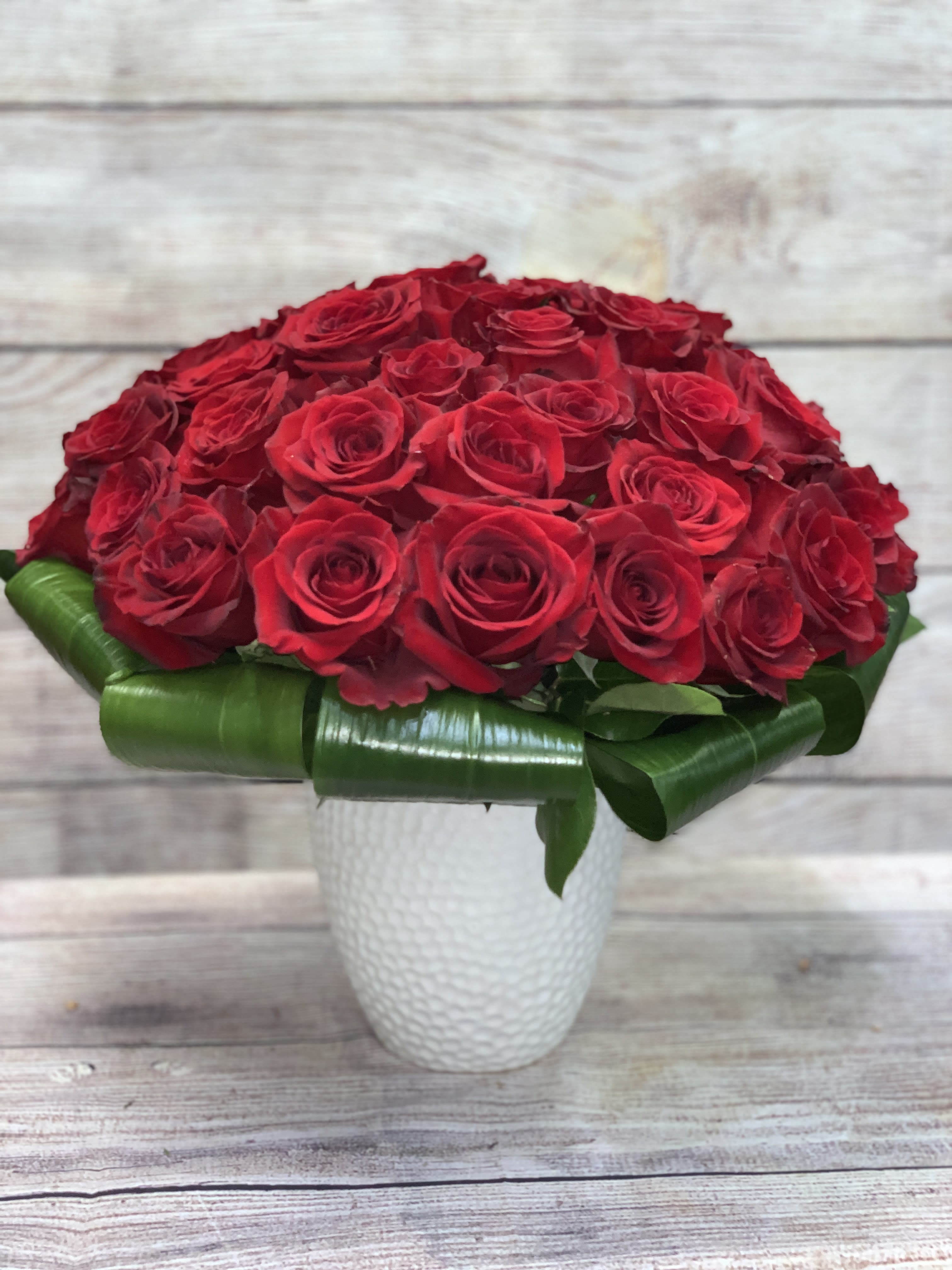 Sweet Fifty - Make your Valentine feel like royalty with this plush and lush arrangement with Fifty of our finest Roses. Available in Red, White, Pink, Purple, Yellow, and Apricot. 