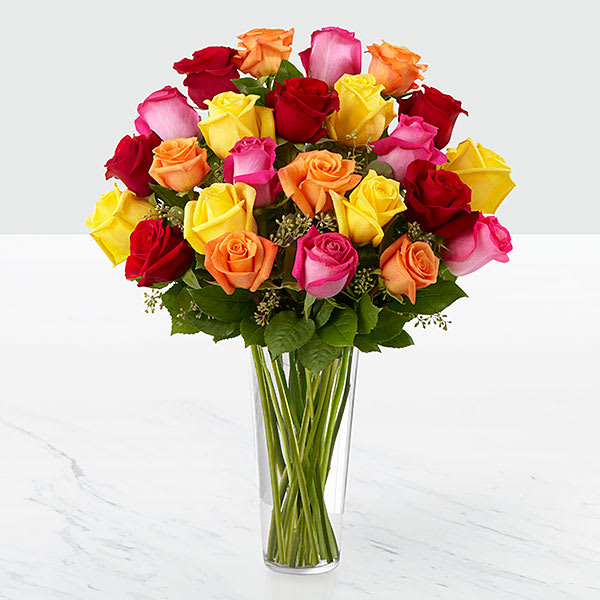 The FTD Bright Spark Rose Bouquet (two dozen roses) The FTD Bright Spark Rose Bouquet (two dozen roses) - This spirited bouquet holds roses in bold hues - hot pink orange red and bright yellow. Certain to be an attention-getter! These vivacious roses are arranged with seeded eucalyptus in a clear glass vase.