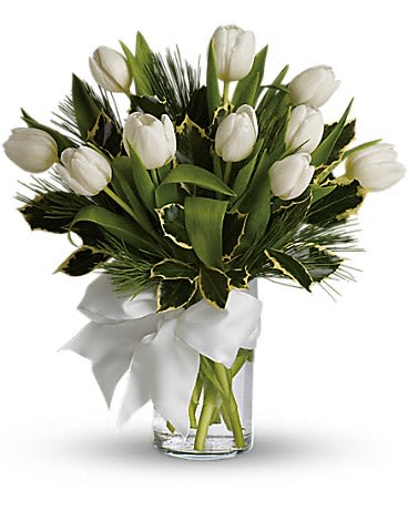 Tulips And Pine Tulips And Pine - For a wintertime bouquet that's as pure as the driven snow send this unexpected gift of ten white tulips accented with aromatic white pine and adorned with a silver ribbon. A simple pleasure for a peaceful season.