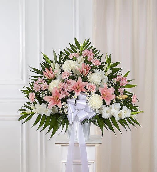 Pink and White Standing Basket - For those who are grieving, a compassionate gesture can mean so much. Our majestic pink and white standing basket arrangement will honor the memory of a loved one in an impressive and meaningful way. Artistically designed by our expert florists with a medley of pink blooms, it is a heartfelt expression of your deepest sympathies.