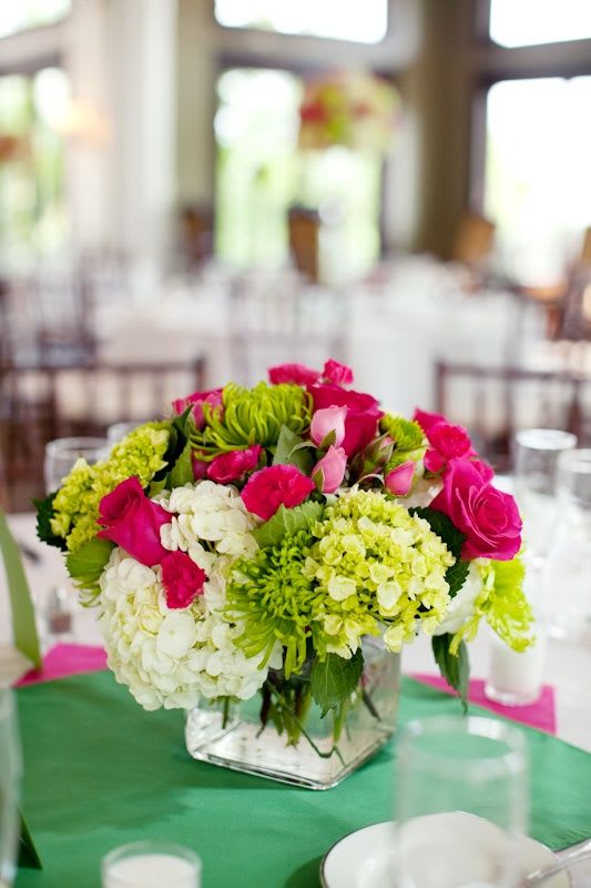 Pink for the table - crystal glass cube with hydrangea, roses, tulips, and other seasonal flowers overflowing. complete any table with this bright assortment.
