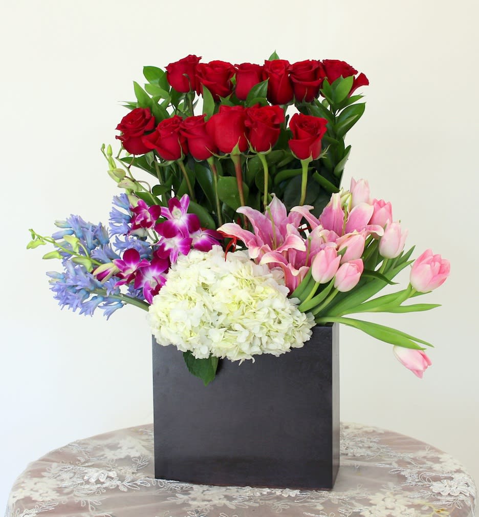 Dozen Rose Mix - Extravagant piece: A Dozen Roses with Tulips, Star Gazer Lilies and Hydrangeas. 